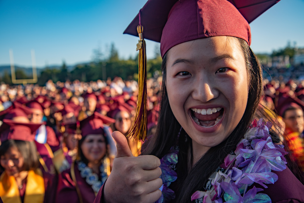 grad with thumbs up