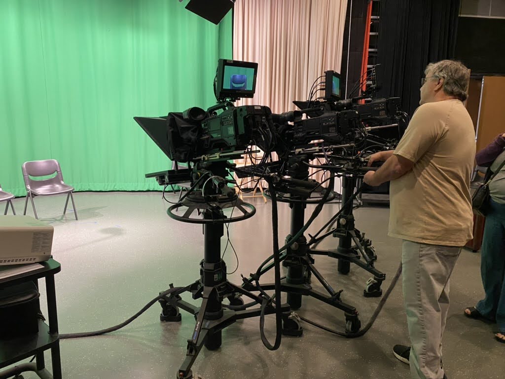 Ed Breault setting up cameras in preparation for the oral history recordings. MLC, May 2024