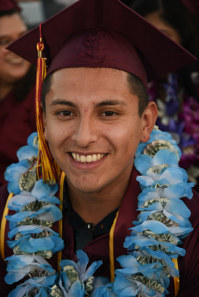 smiling young man with flowers