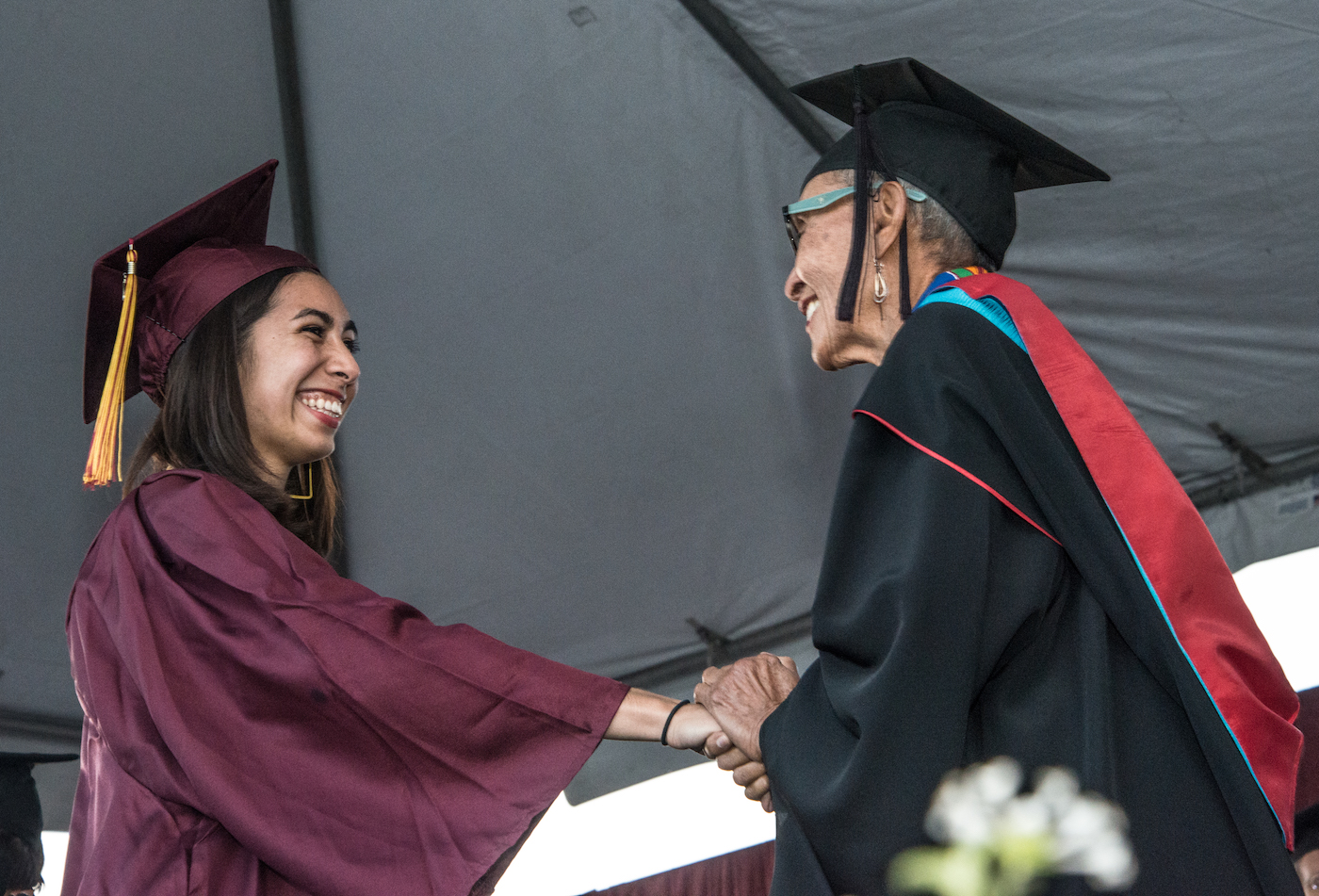 Dean congratulating student