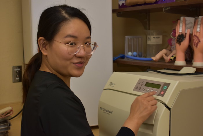 student with equipment