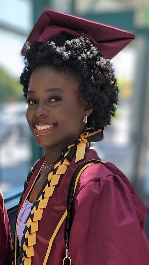 student in profile with grad cap and gown