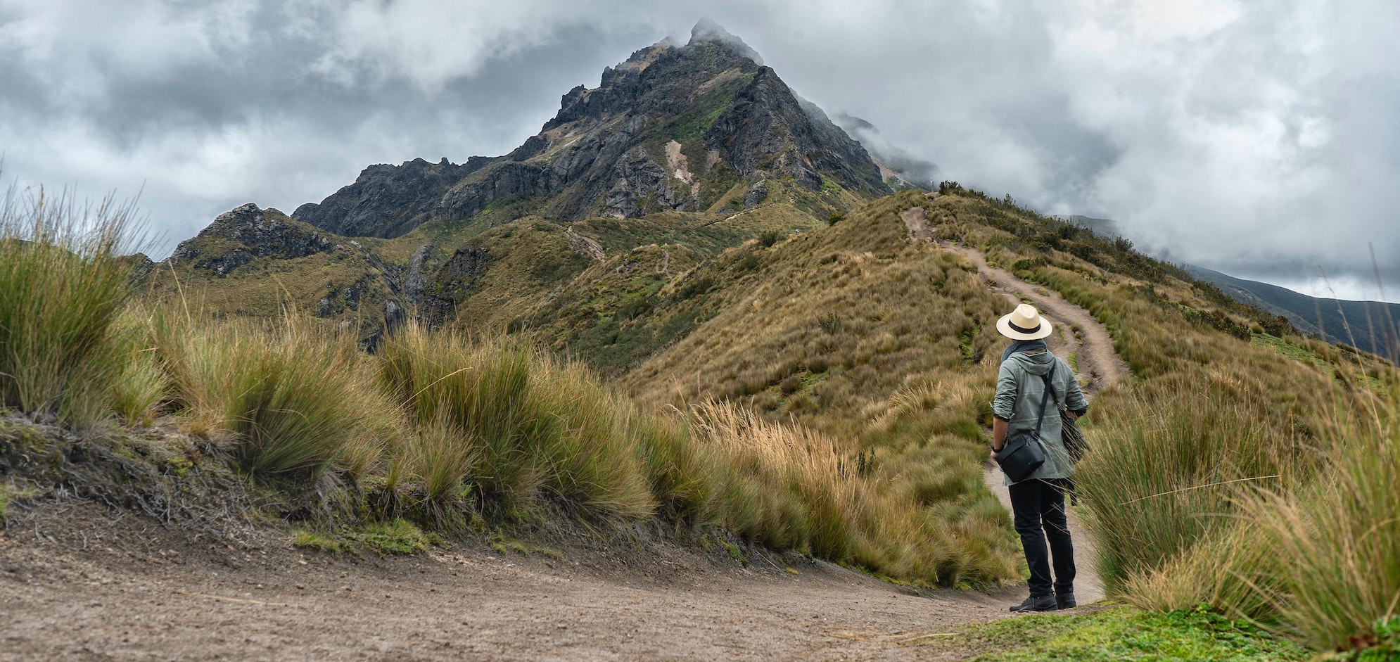 man in front of mountain